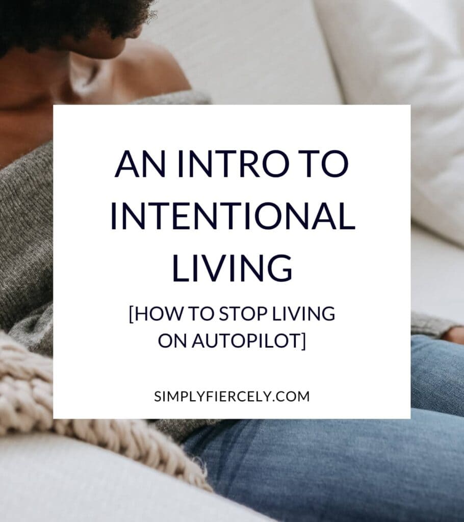 "An Intro to Intentional Living How to Stop Living on Autopilot" in a white box woman wearing a grey sweater and jeans sitting on a sofa in the background.