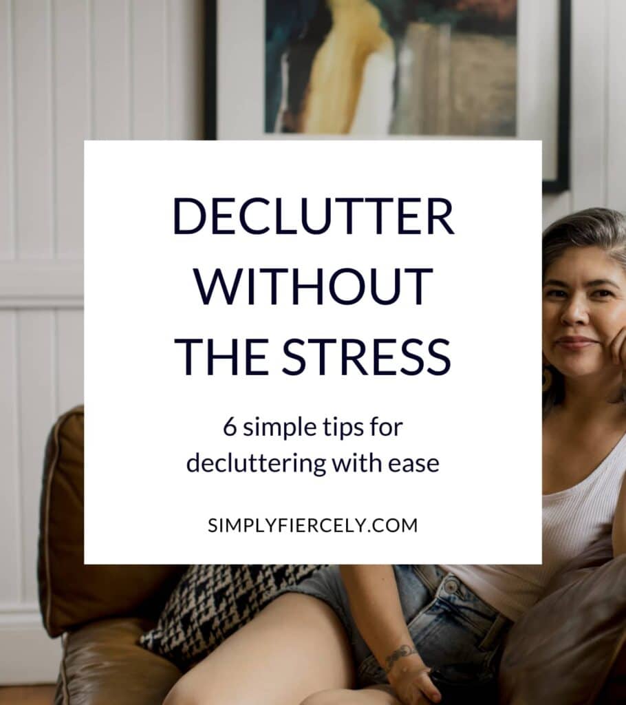 "Declutter Without Stress: 6 Simple Tips For Decluttering With Ease" in a white box with a woman wearing denim shorts and a white tank top sitting on a brown leather sofa and smiling into the camera in the background.