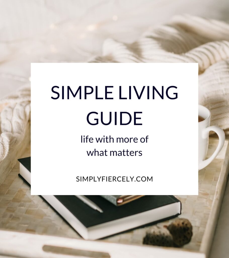 Simple Living Guide: life with more of what matters in a white square overlay with an image of an ivory colored tray holding a book, journal, pen, and mug of tea on top of a bed with cream linen.