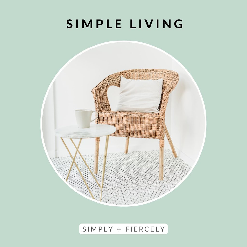 A circular image of a wicker chair that has a throw pillow on it and a small round table with a coffee mug on it on a white tiled floor on a green background with the words Simple Living across the top
