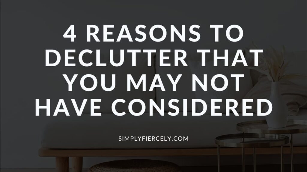 "4 Reasons to Declutter That You May Not Have Considered" on a black overlay background with an image of a sofa with a round table and a vase in the background.