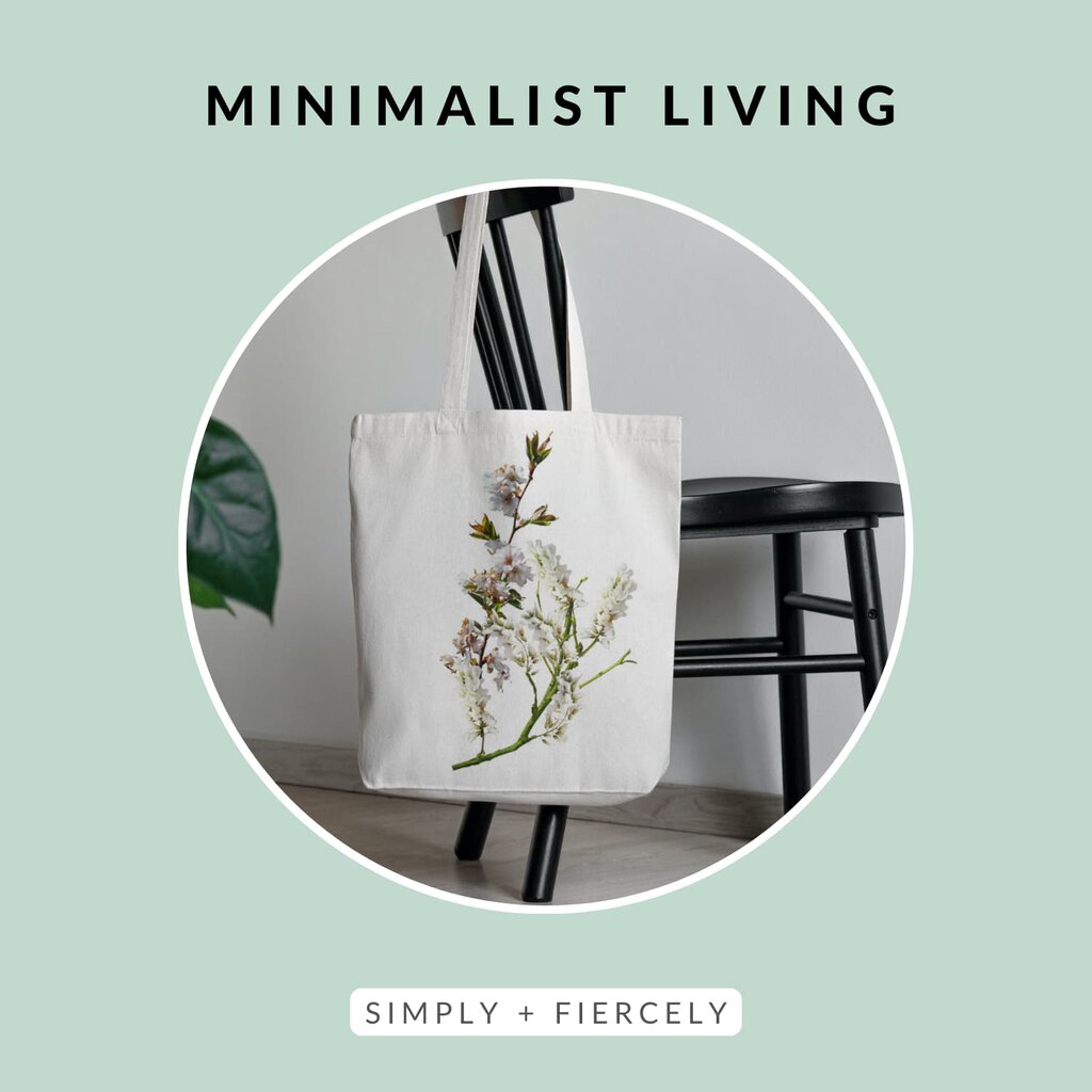 A round image of a wooden chair with a fabric shopping bag with floral embroidery hanging on it on a green background with the words Minimalist Living across the top.