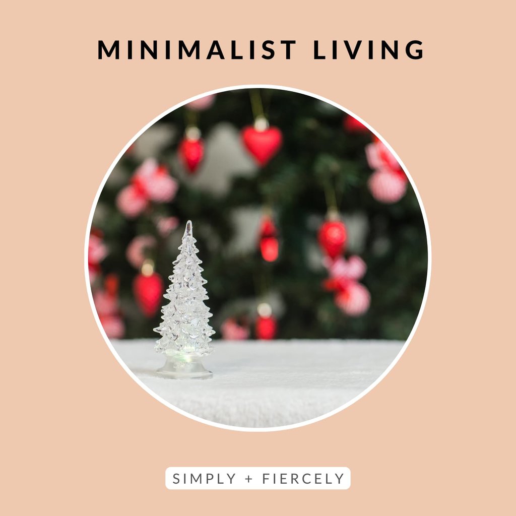 A round image of a small crystal Christmas tree with a Christmas tree blurred out in the background on a orange background with the words Minimalist Living across the top.