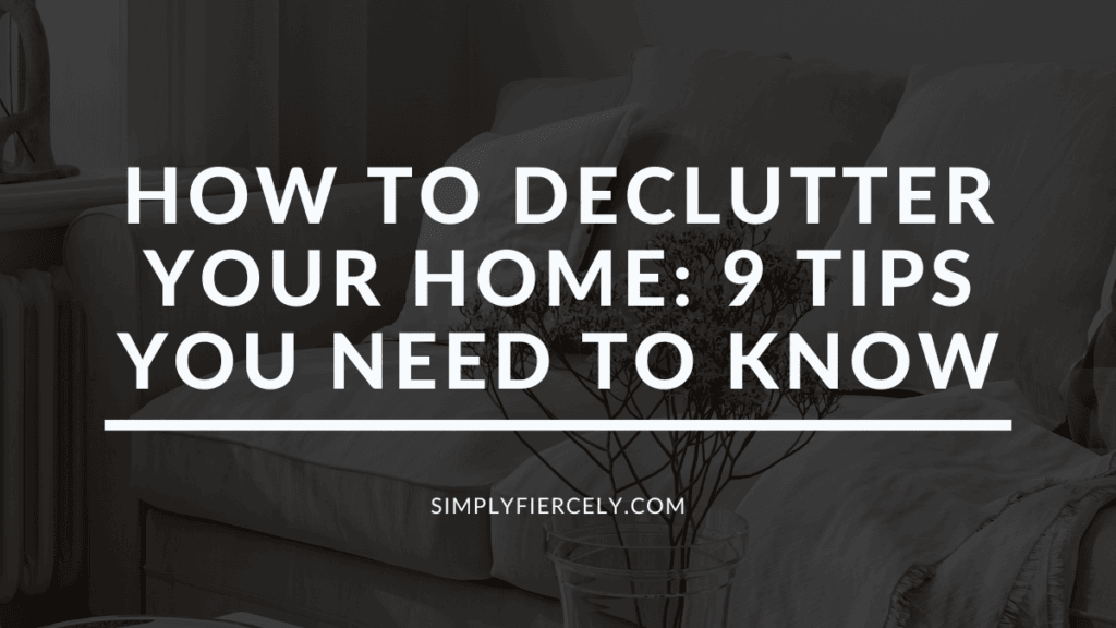 "How To Declutter Your Home: 9 Tips You Need To Know" in white letters on a black translucent overlay on top of an image of a white sofa with a vase of dried flowers in a minimalist home.